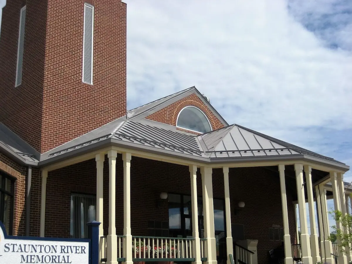 Skilled roofing craftsmen working on a residential roof in East Hamilton